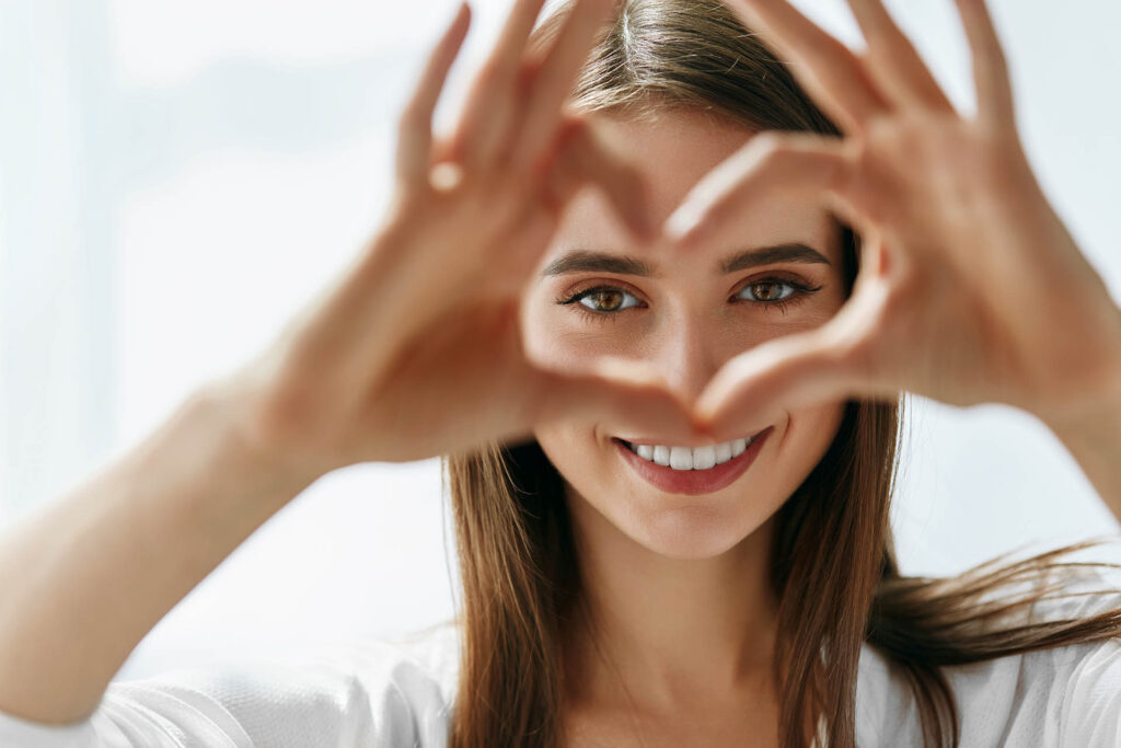 Healthy,Eyes,And,Vision.,Portrait,Of,Beautiful,Happy,Woman,Holding